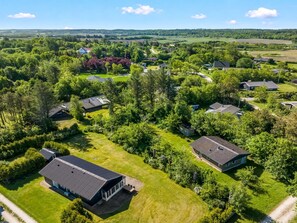 An aerial view of a residential area with houses surrounded by greenery and fields. - "Ulpu" - 500m to the fjord by Interhome (Løgstør)