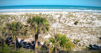Ocean Views, Balcony, Private Pool & Beach access, full kitchen with everything you need, Private Laundry in suite. Free Parking.