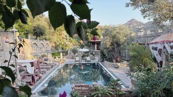 Seasonal outdoor pool, pool umbrellas, sun loungers