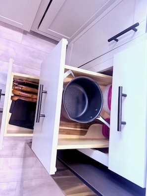A kitchen with a drawer containing cooking utensils and a frying pan. - New! Oceanside Oasis - 2nd Home from Beach (Seaside Park)