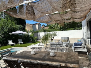 A patio with a pool, outdoor furniture, and a pergola. - Magnificent Villa With Swimming Pool in Marseille (Marseille)