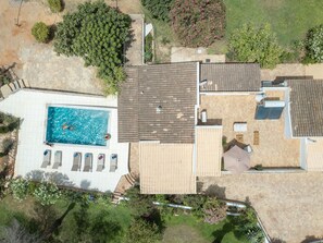 An aerial view of a residential property with a swimming pool, multiple rooms, and a garden. - Accessible Algarve Villa with Private Pool, Brand-New Jacuzzi & Ocean ViewsLvPremier Algarve AB1 (Luz de Tavira)