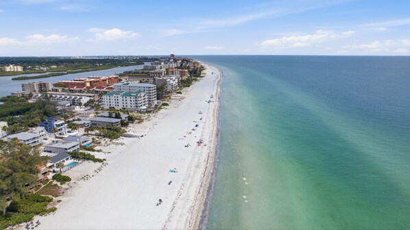 A coastal hotel with multiple buildings, a beach, and a river. - Steps to Beach | Family Retreat w/ Community Pool (Indian Shores)