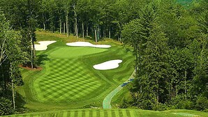 A golf course with sand bunkers, a water hazard, and dense forested areas. - BLOCK Club Lodges at Trillium Presidential (Cashiers)