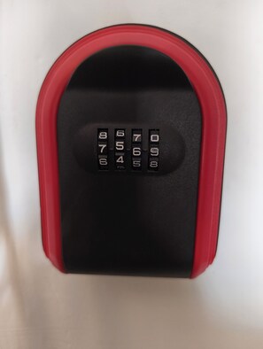 A keypad with numbers 0-9 and a lock mechanism. - SkyNest stays- A private terrace garden | Near cyber hub  & galleria market |  (Gurugram)