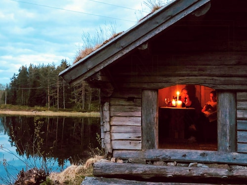 Traditional farmstead with dock near Vegår
