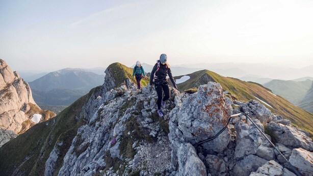 A mountainous landscape with rocky terrain and distant snow-capped peaks. - BASE Achensee Energy N°26 (Achenkirch)