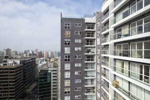 A high-rise building with multiple floors, large windows, and balconies. - Your Furnished Apartment on Pardo Avenue, Miraflores, Lima – Excellent Location (Miraflores)
