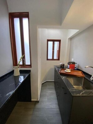 Estúdio conforto, vista para o pátio | Cozinha privada
