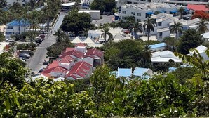 A coastal town with buildings, a marina, and a clear view of the sea. - Modern Pelican St. Maarten Escape with Pool, Views & Outdoor Lounge (Cole Bay)