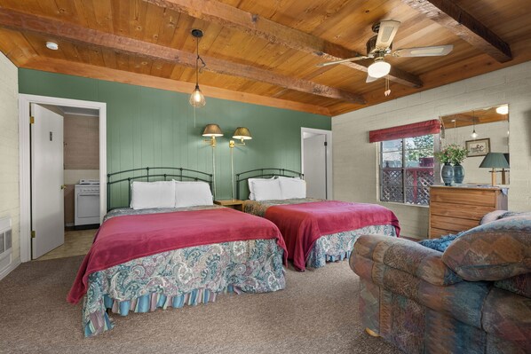 A bedroom with two beds, a wooden ceiling, a window with a view, and a dresser. - Family Sierra Cabin for 4 near Topaz Lake, Yosemite 2 Queens, Kitchen + Tub (Coleville)