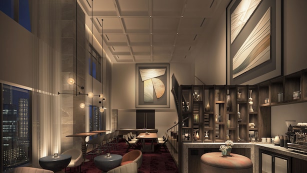 Um interior moderno com área de bar, assentos e vista para a cidade.