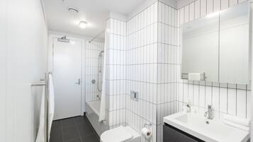 Shower, hair dryer, towels, shampoo