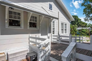 A white wooden house with a porch and a fenced deck area. - 3/2 Punta Gorda - Near Airport & I-75 (Punta Gorda)