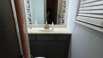 Shower, hair dryer, towels, toilet paper