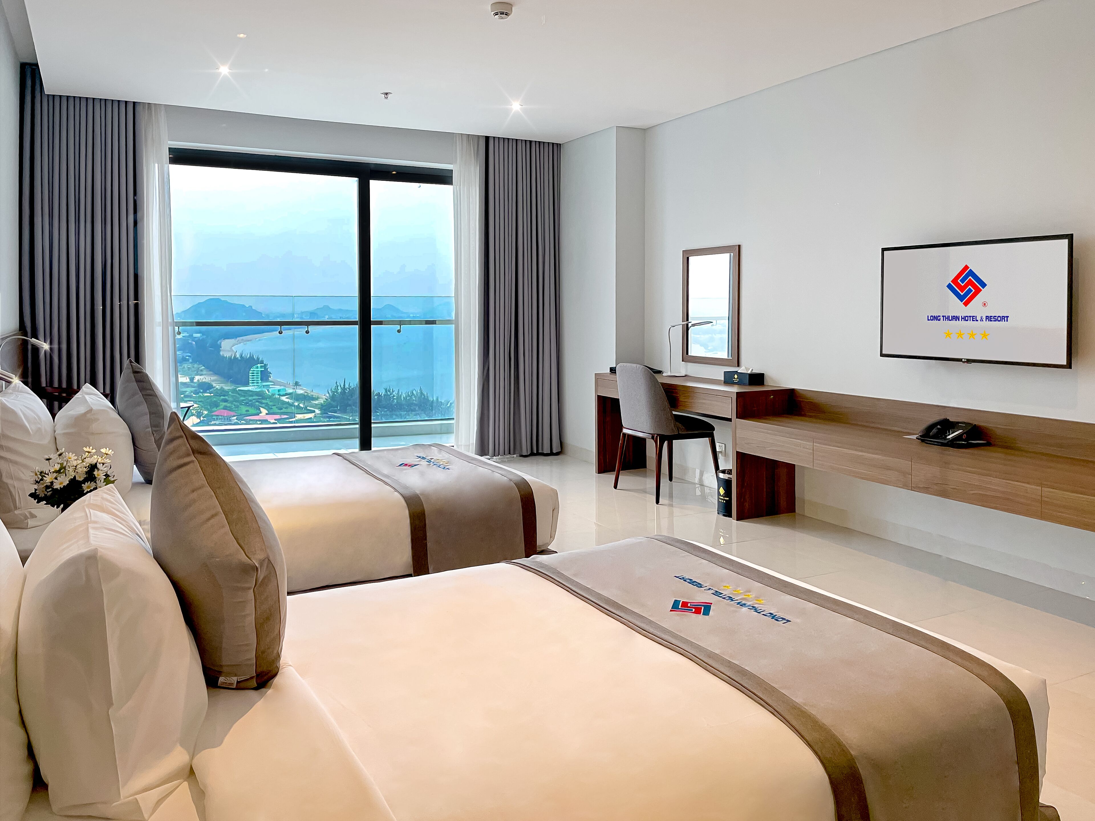 Habitación Deluxe con 2 camas individuales, balcón, vista al océano | Minibar, wifi gratis y ropa de cama 