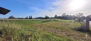 A rural landscape with fields, trees, and a distant building. - The Gîte de Préaux: a single-story house with 3 bedrooms (sleeps 6) (Tousson)