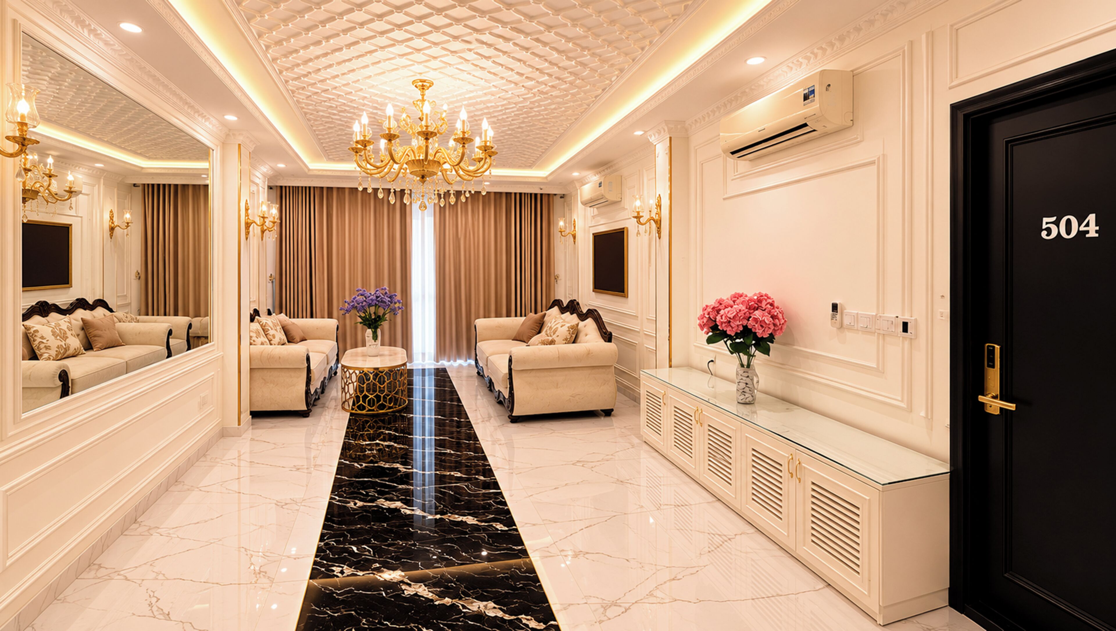 A luxurious hotel lobby with marble flooring, two sofas, a chandelier, and a black door marked with the number 504.
