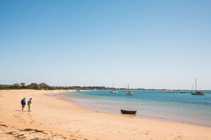 A beach with clear water, boats, and a few people. - The Family Beach Base, Port Sorell (Port Sorell)