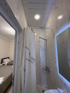 Shower, slippers, towels, soap