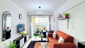 Comfort Apartment, Balcony | Living area | 32-inch Smart TV with digital channels