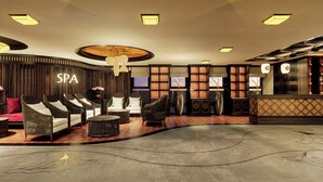 A spa area with seating, a reception desk, and a wall-mounted sign. - Amiana Hotel Hanoi (Hanoi)