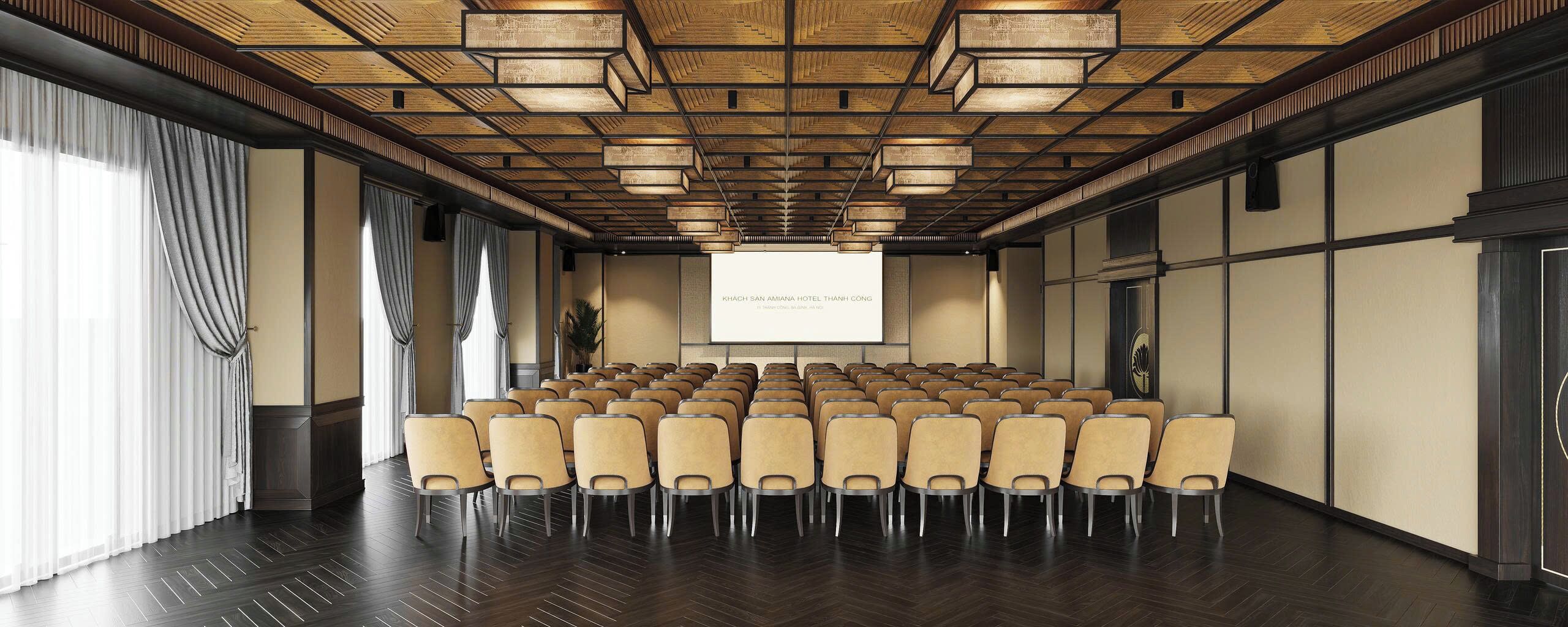 A conference room with rows of chairs, a projector screen, and a wooden ceiling.