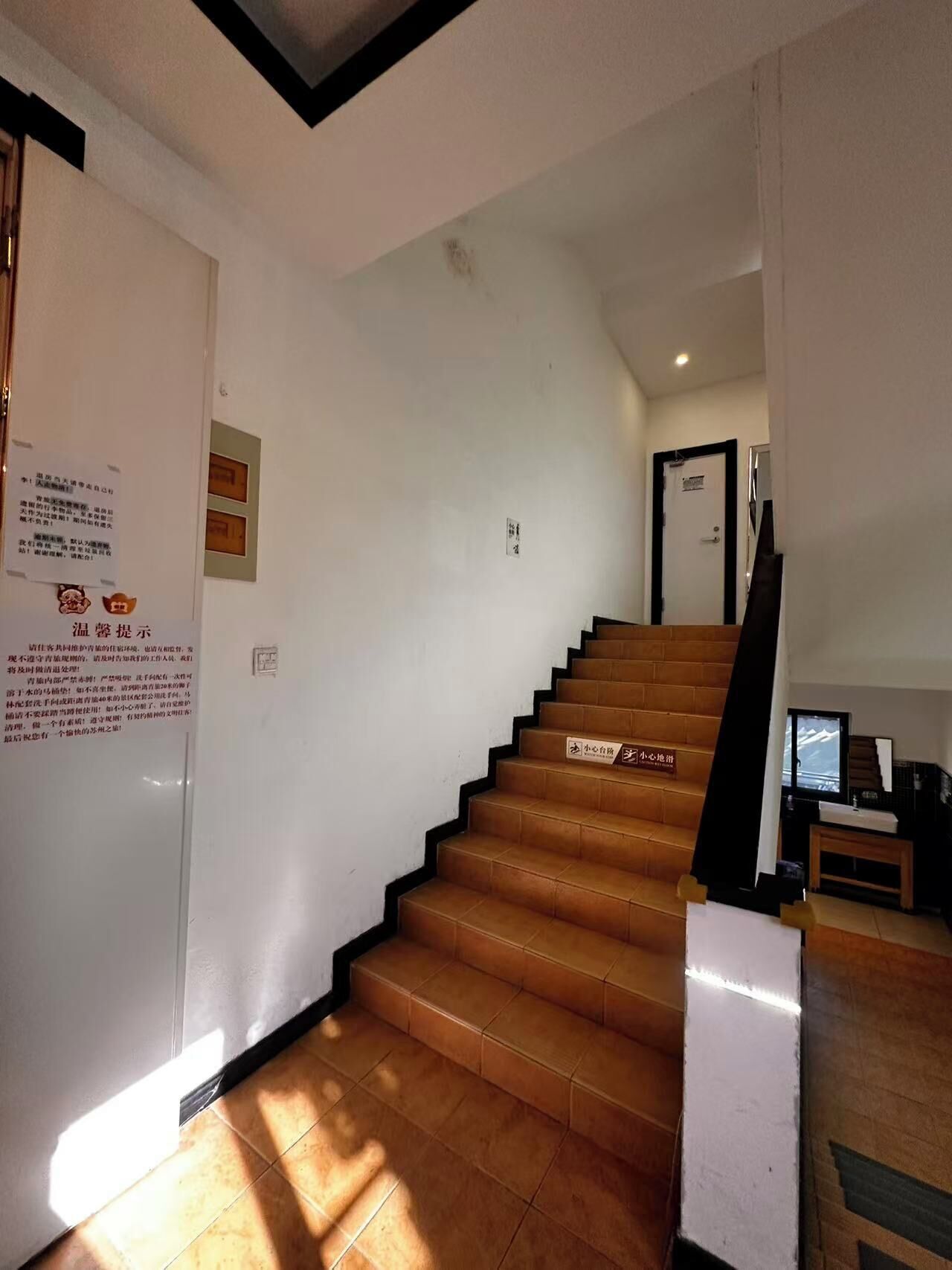 A staircase with wooden steps leading to a landing.