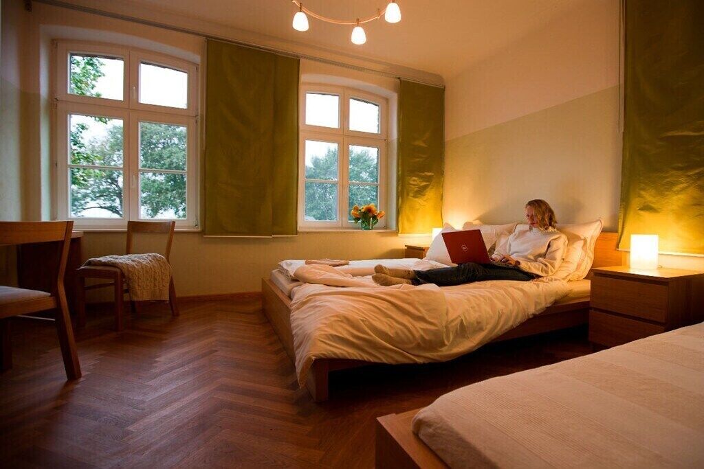 Desk, iron/ironing board, bed sheets