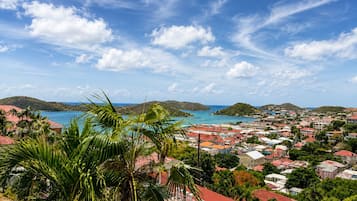 A coastal town with a view of the sea and hills.