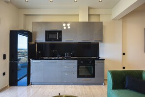 Deluxe Suite, Balcony, Sea View | Private kitchen | Full-size fridge, microwave, oven, highchair - MGM Suites (Panormos in Rethymno)