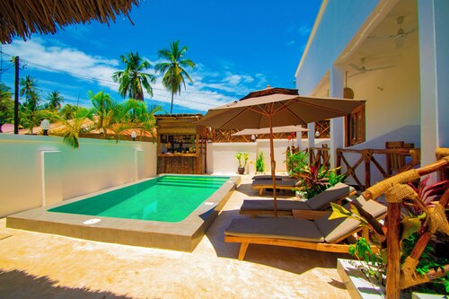 Villa with two double master suites, a private pool, and an exclusive beach area