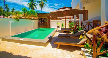 Villa with two double master suites, a private pool, and an exclusive beach area