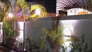 A nighttime view of a building with a white exterior and palm trees in front. - Villa with two double master suites, a private pool, and an exclusive beach area (Kiwengwa)