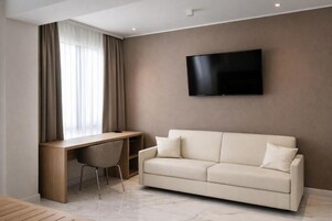 Habitación triple | Zona de estar