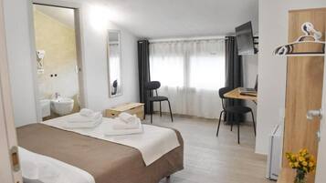 Classic Double or Twin Room, Garden View | Desk, laptop workspace, blackout drapes, iron/ironing board