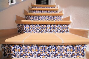 A set of outdoor stairs with a patterned tile design. - VILLA VANGOH T2 Sunnypool (Luz)