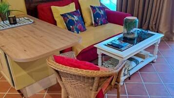 Appartement Confort, vue jardin | Coin séjour