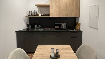 Studio, Private Bathroom | Shared kitchen | Fridge, microwave, stovetop, cookware/dishes/utensils