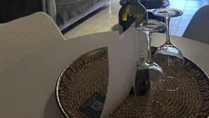 A modern living room with a sofa, dining table, and a view of the outdoors. - RHODESIA guest house
Sea view apartment
Pet friendly
2’  beach (Chalkida)