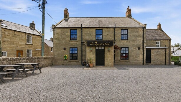 A stone building with a sign reading 'The Queen's Head.' - Ghyllstead - North East Escapes (Glanton)