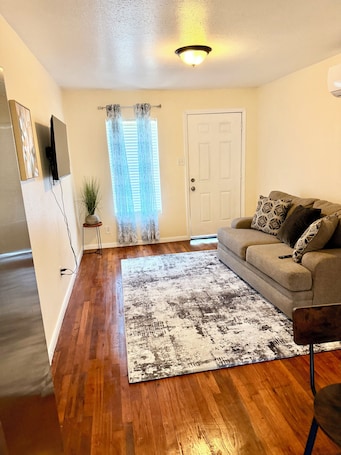Living area. Leah’s Den- 1-bedroom apartment with AC in vibrant Houston Downtown attractions!