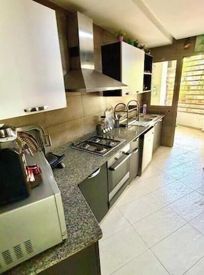 Coffee/tea maker, fridge, microwave, oven