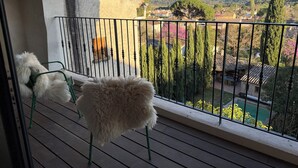 A balcony with a view of a mountainous landscape, a pool, and a garden. - The Hôtel Particulier 1900, a 500m² country house in the Var region (Pignans)