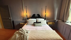 A bedroom with a large bed, bedside tables with lamps, a door, and a window with curtains. - The Hôtel Particulier 1900, a 500m² country house in the Var region (Pignans)