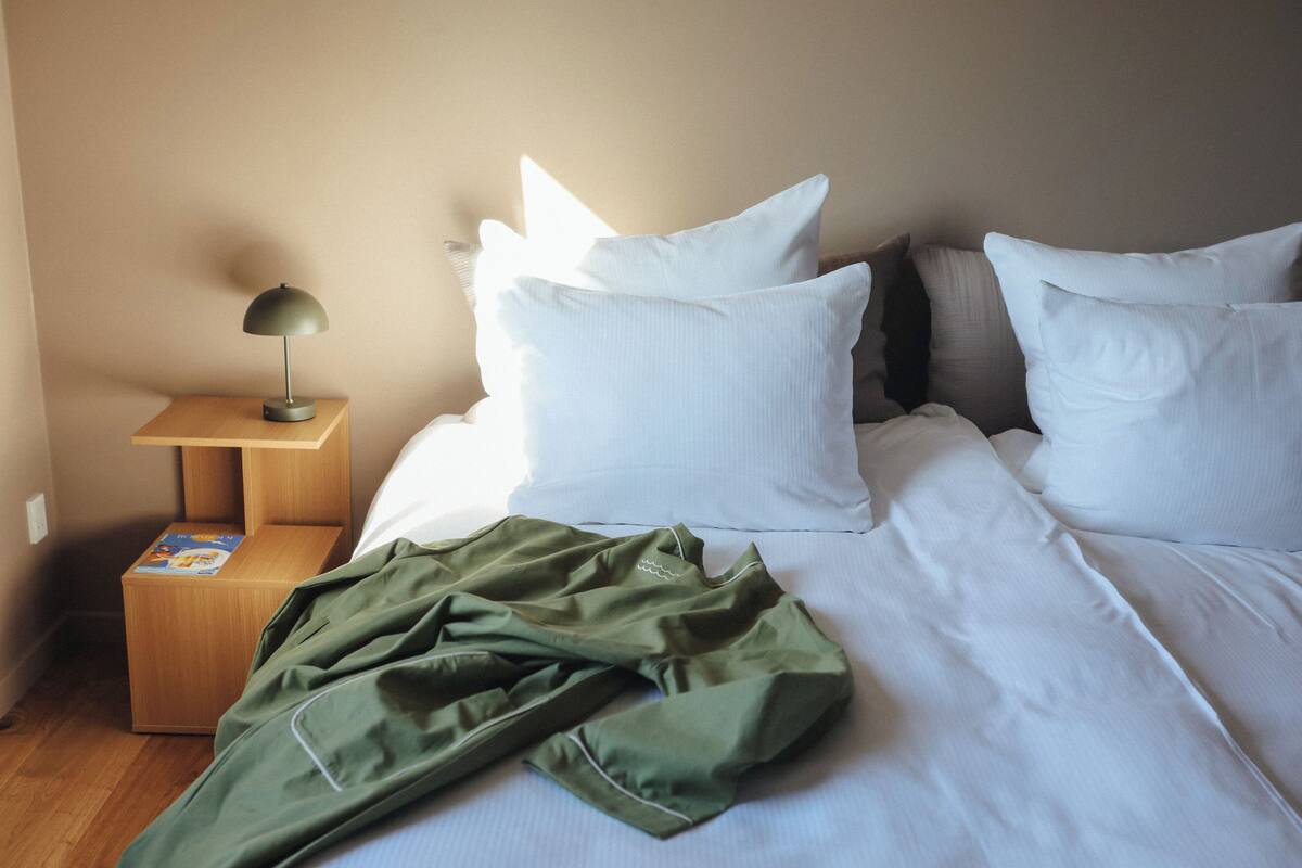 Premium bedding, down comforters, pillowtop beds, blackout drapes