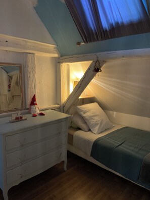 A bedroom with a bunk bed, a dresser, a mirror, and a small Christmas tree decoration. - THE HOUSE NEXT DOOR TO STRASBOURG (Illkirch-Graffenstaden)