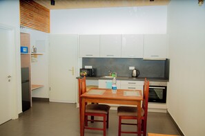Private kitchen - Afro-Boho 1 Bedroom Balcony Suite at Blue Lagoon Resort Paje (Paje)