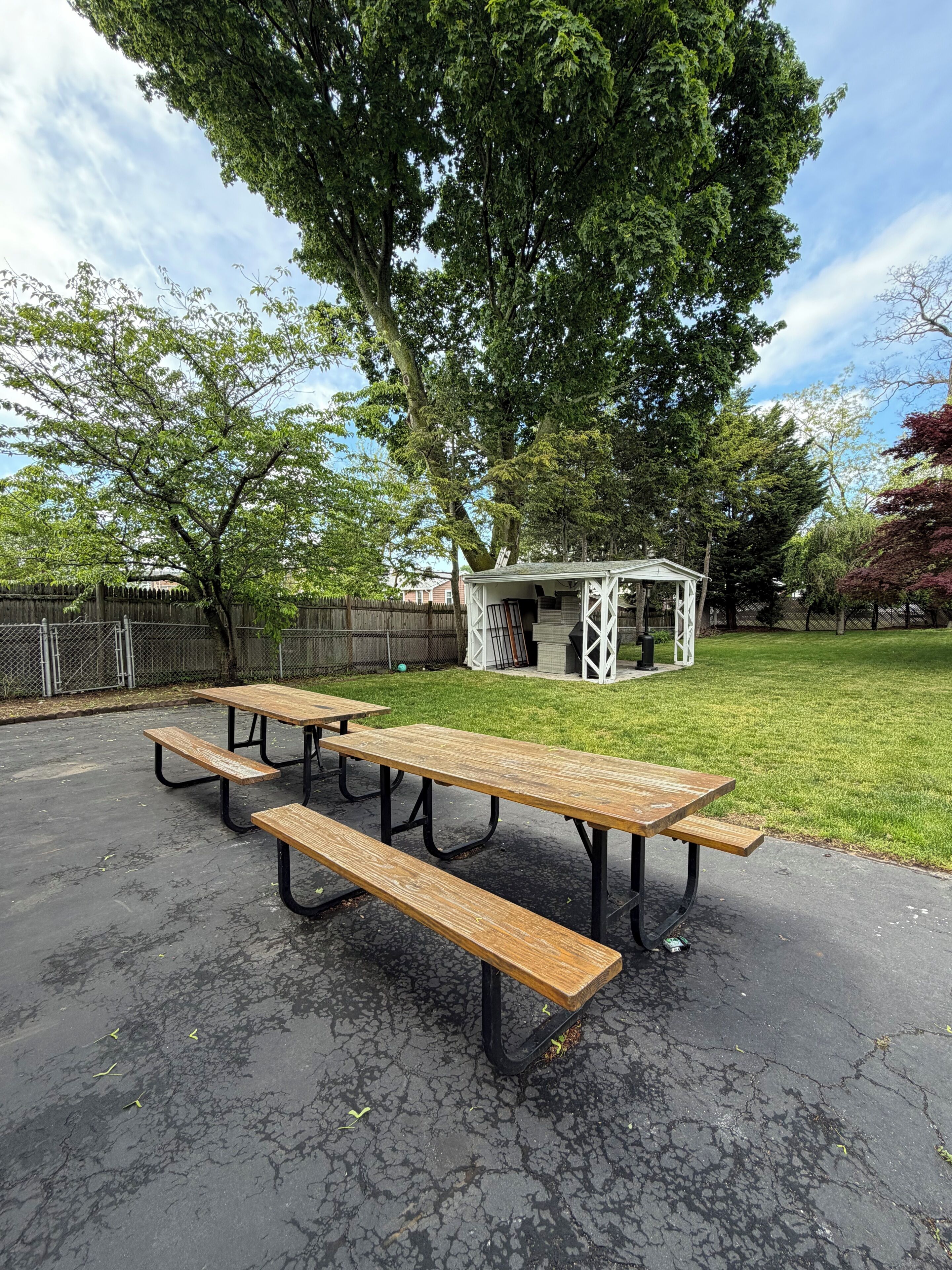 A picnic area with benches and a gazebo.