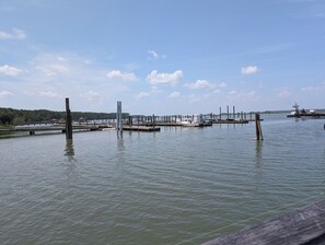 A marina with multiple docks and boats. - Canoe Club Loft - Dock slip available (Daufuskie Island)